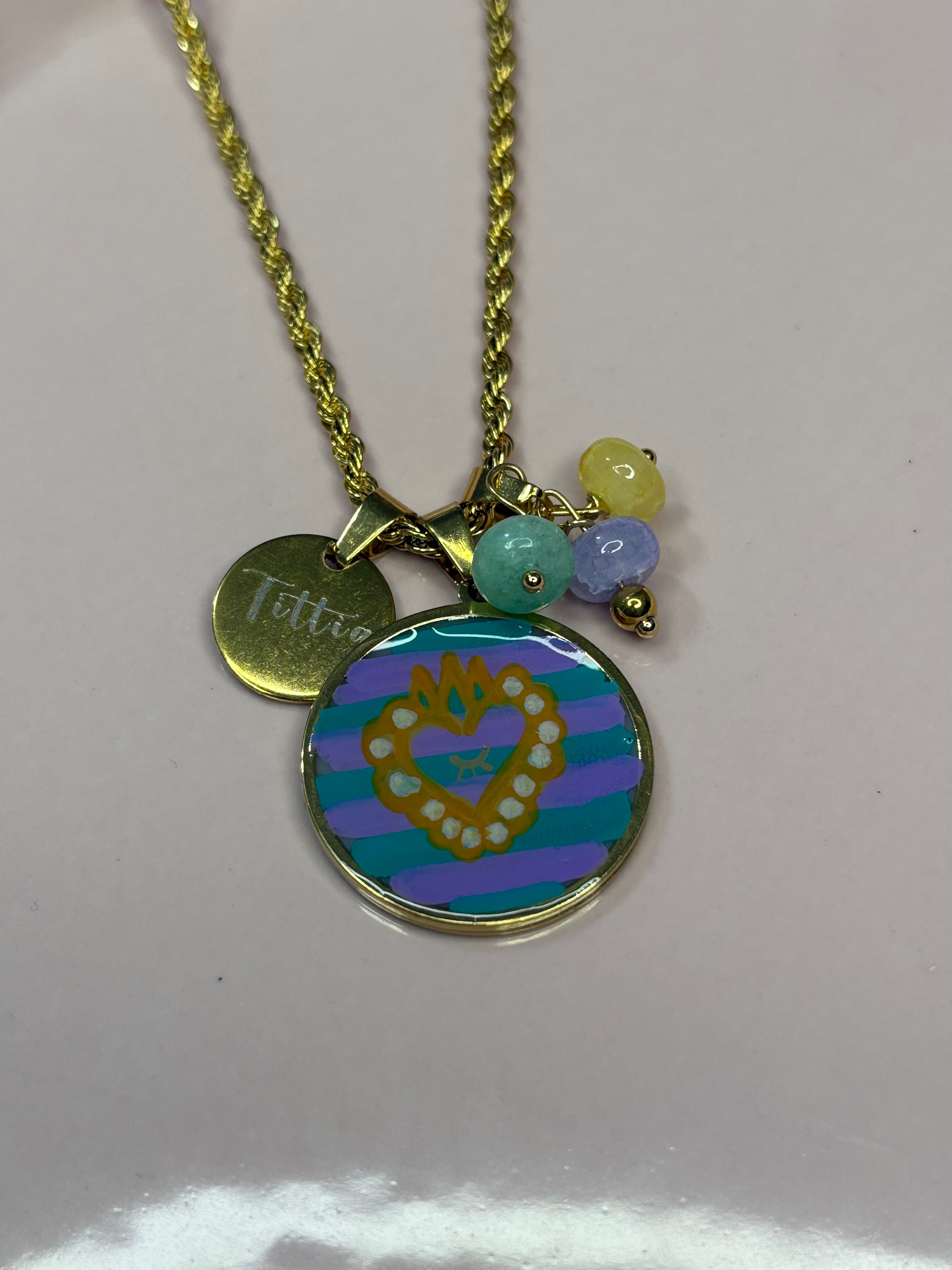 Medaglia ocra lilla acqua