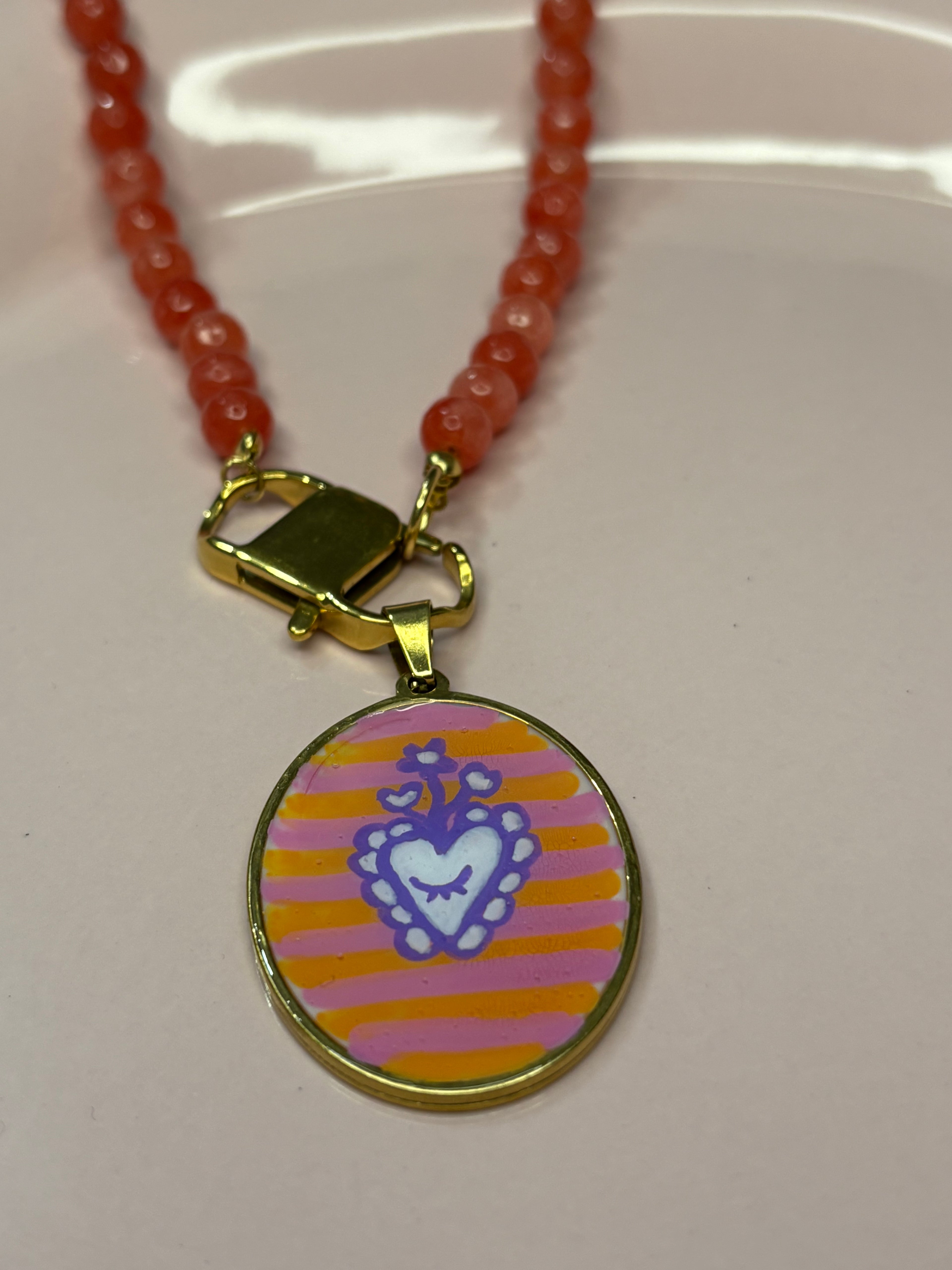 STOLEN arancio medaglione